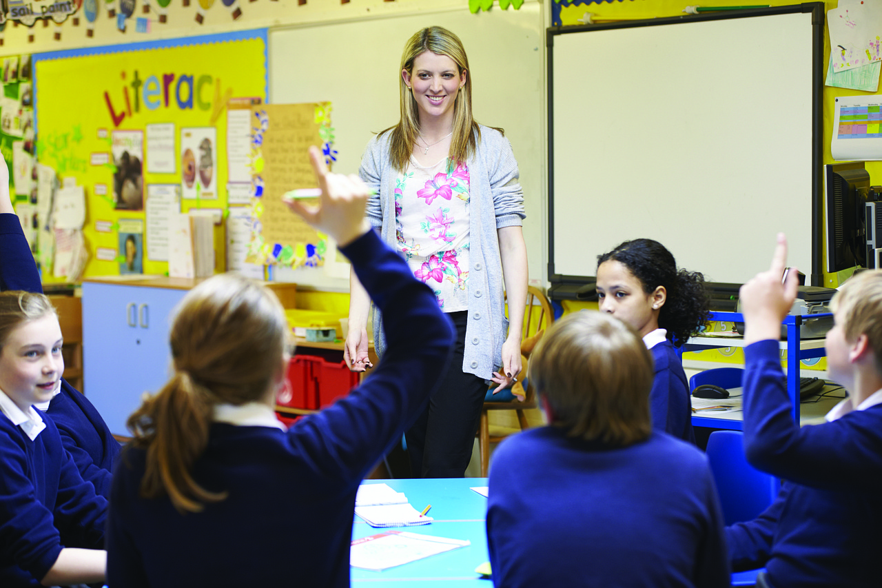 Teacher in front of a classroom of children